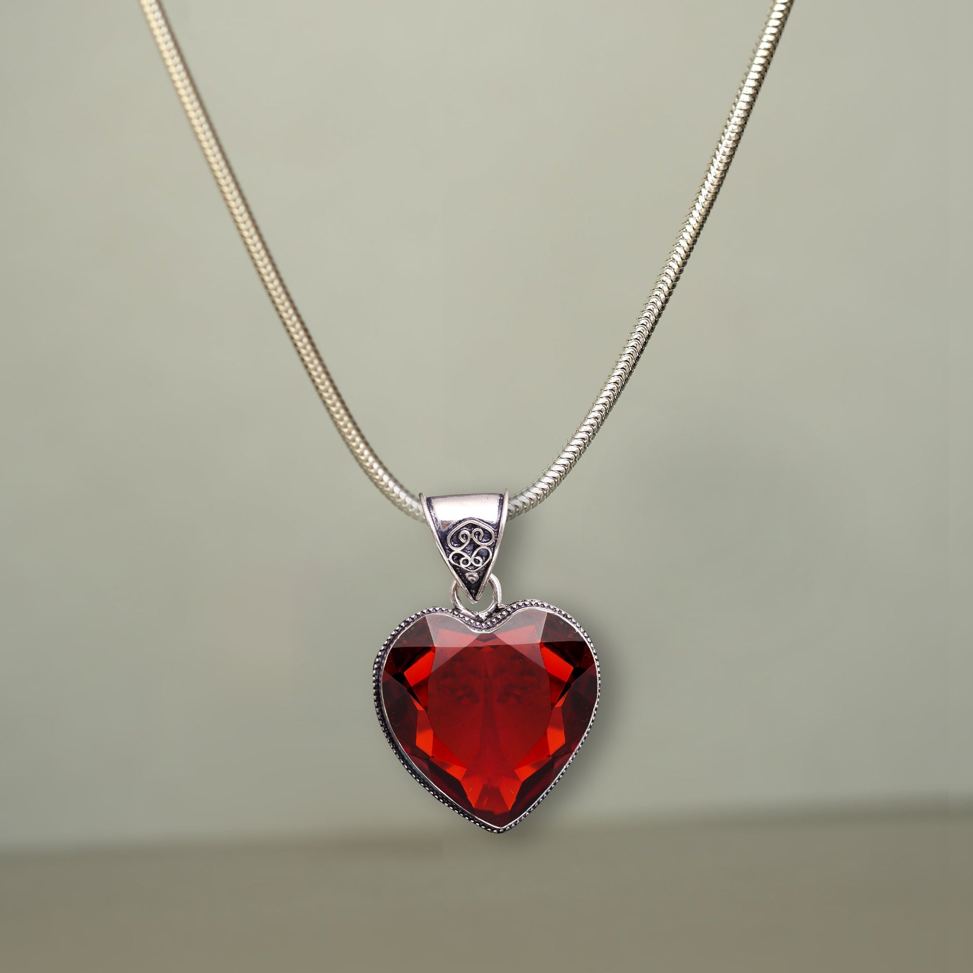 The Beauty and Meaning Behind Our Garnet Heart Pendant